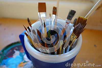 A cup of paint brushes