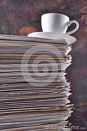 Cup on a pile of papers