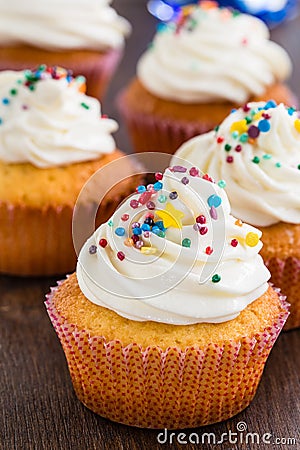 Cupcakes with white frosting and sprinkles