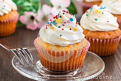 Cupcakes with white frosting and sprinkles