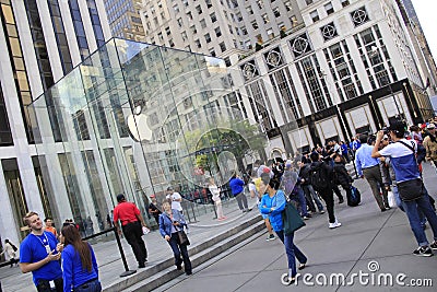 Customers line up outside of the Apple Store on Fifth Avenue to buy the new iPhone 6