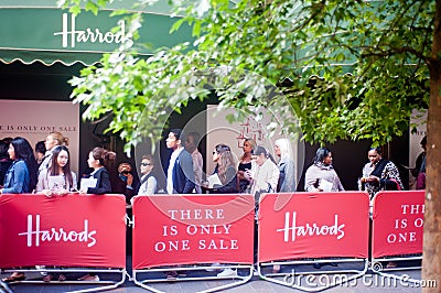 Customers queue outside Harrods in London