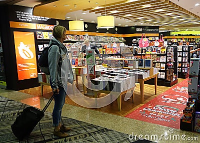 Customers shop for books in Changi Airport, Singapore