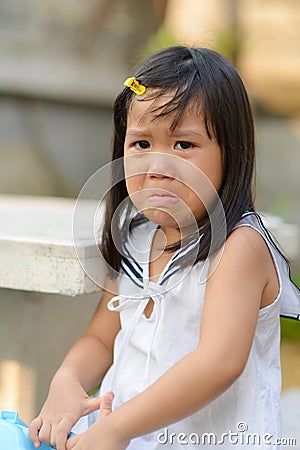 Cute Asian child crying