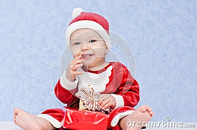 Cute baby boy santa helper