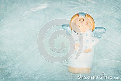 Cute blue colored angel on textured background