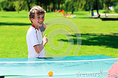 Cute boy playing table tennis