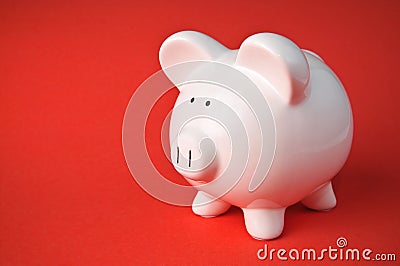 Cute Ceramic Piggy Bank on Red Background