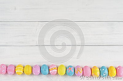 Cute Easter Egg Line Up on Rustic White or Gray Wood Boards for Background with space or room for text, copy, words.