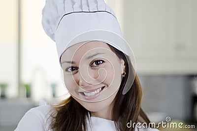 Cute female chef loving her job