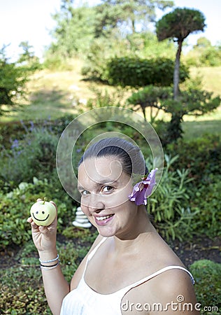 Cute girl holding happy apple