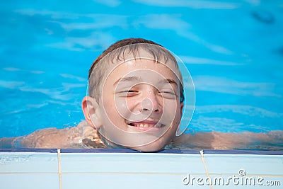 Cute guy smiling in the pool