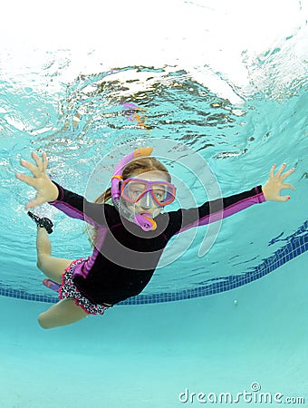 Cute kid underwater in pool