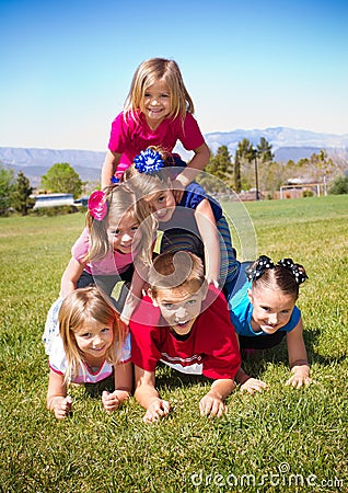 Cute Kids Building a Human Pyramid
