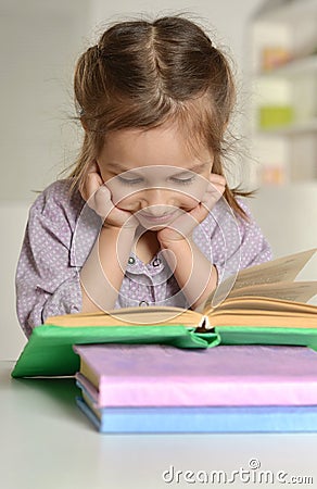 Cute little girl with a book