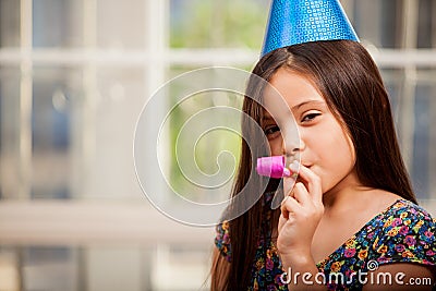 Cute little girl in a party hat