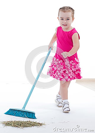 Cute little girl sweeps a floor isolated on white