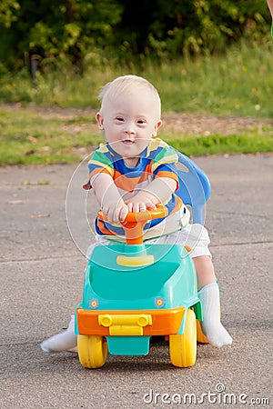 Cute smiling baby boy with Down syndrome