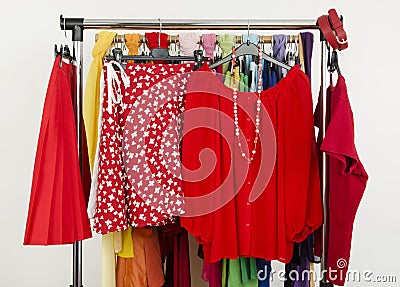 Cute summer red outfits displayed on a rack.