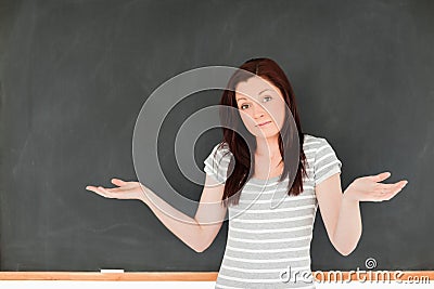 Cute woman against a blackboard