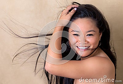 Cute Young Asian Woman With Blowing Hair