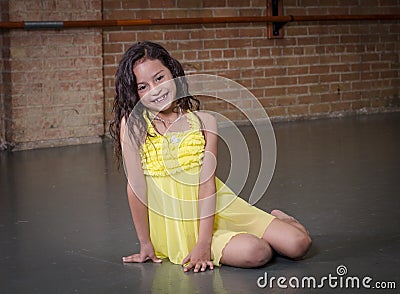 Cute young hispanic dancer in a dance studio
