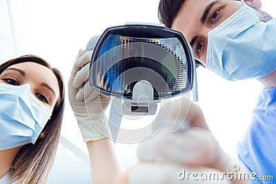 Cute young woman at the dentist. Mouth checkup