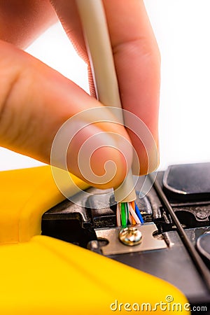 Cutter cutting a network cable on white background