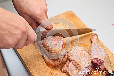 Cutting a chicken leg