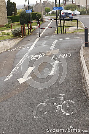 Cycle track markings painted on the footway