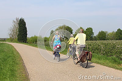 Cycling people at the Apple Dike,Betuwe,Holland