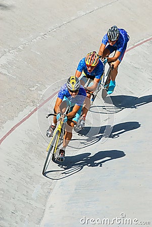 Cycling team racing on velodrome