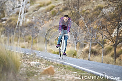 Cyclist man riding fixed gear sport bike
