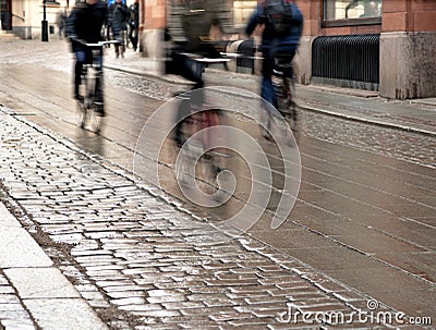 Cyclists on wet street