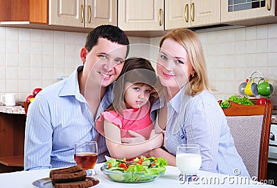 Dad, Mom and their little daughter