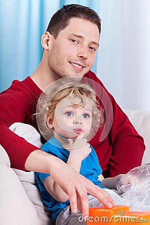 Dad and son sitting on the couch