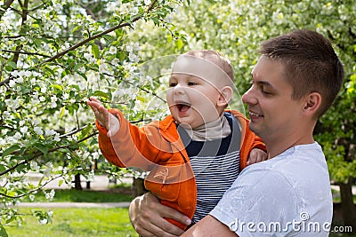 Dad and son walking in the park