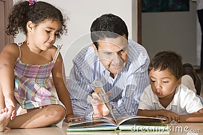Dad teaching children