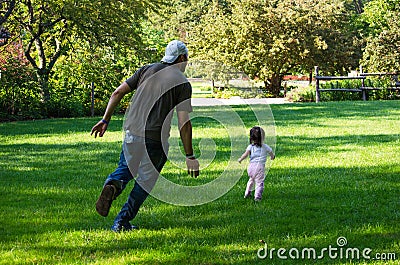 Daddy chasing after little girl