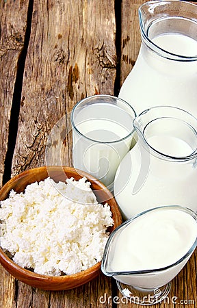 Dairy products on wooden background.