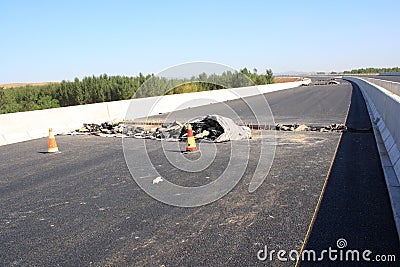 Damaged asphalt road