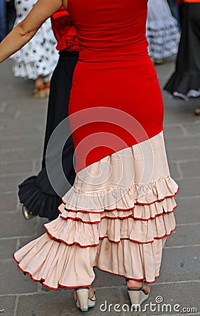 Dancers expert and Spanish dance with elegant period costumes