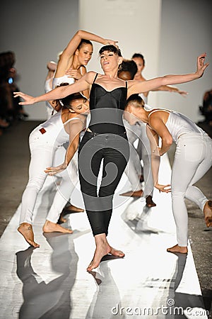 A dancers performs on the runway at the DL 1961 Premium Denim spring 2013 fashion show