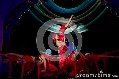 Dancing group in red