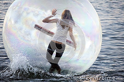 Dancing on a water girl inside plastic ball