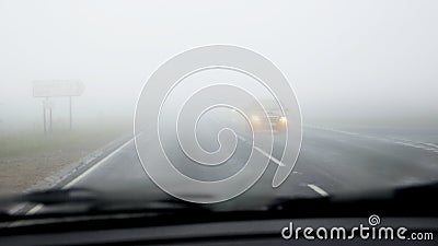 Dangerous driving on road in fog