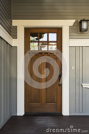 Dark wood front door of a home