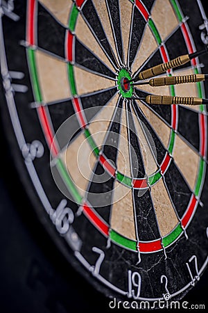 Darts in the center of a dartboard