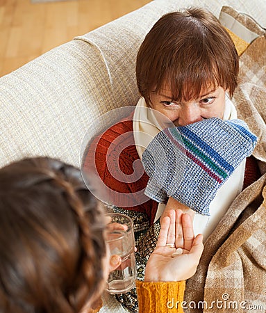 Daughter caring for sick mature mother has cough