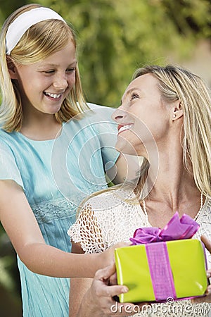 Daughter Giving Present To Mother